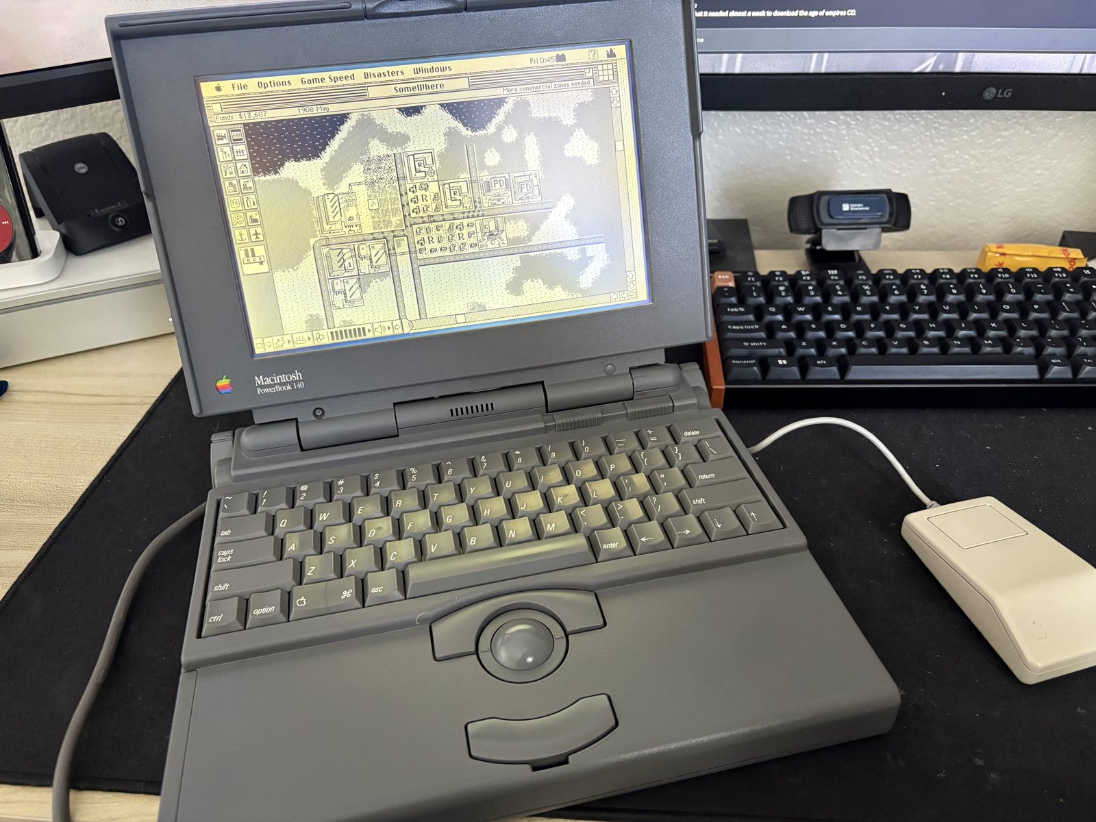 The PowerBook 140 running SimCity.